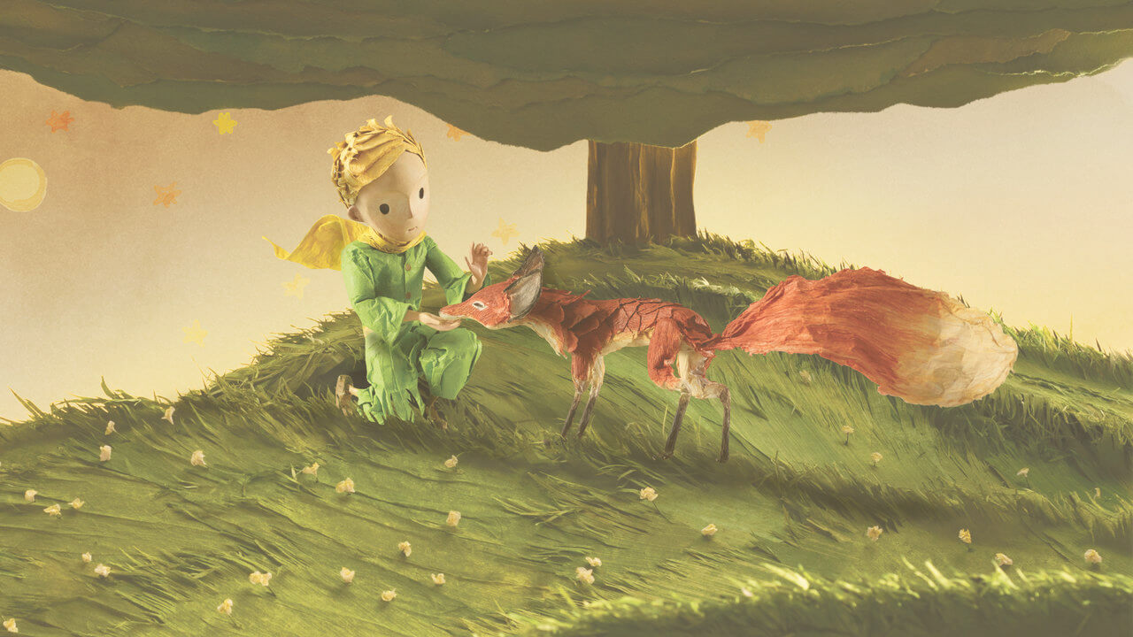 the little prince with the fox near the baobap