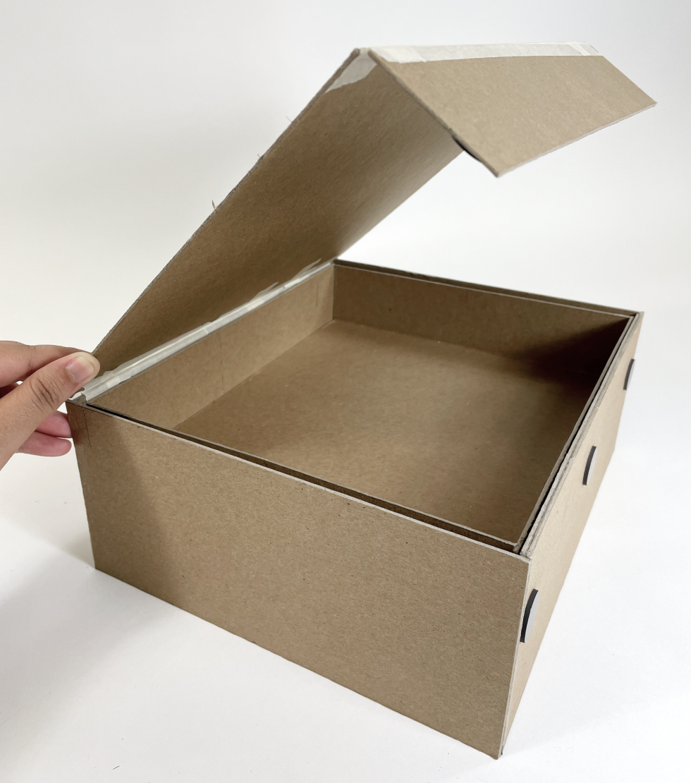 undesigned box prototype open with top tray