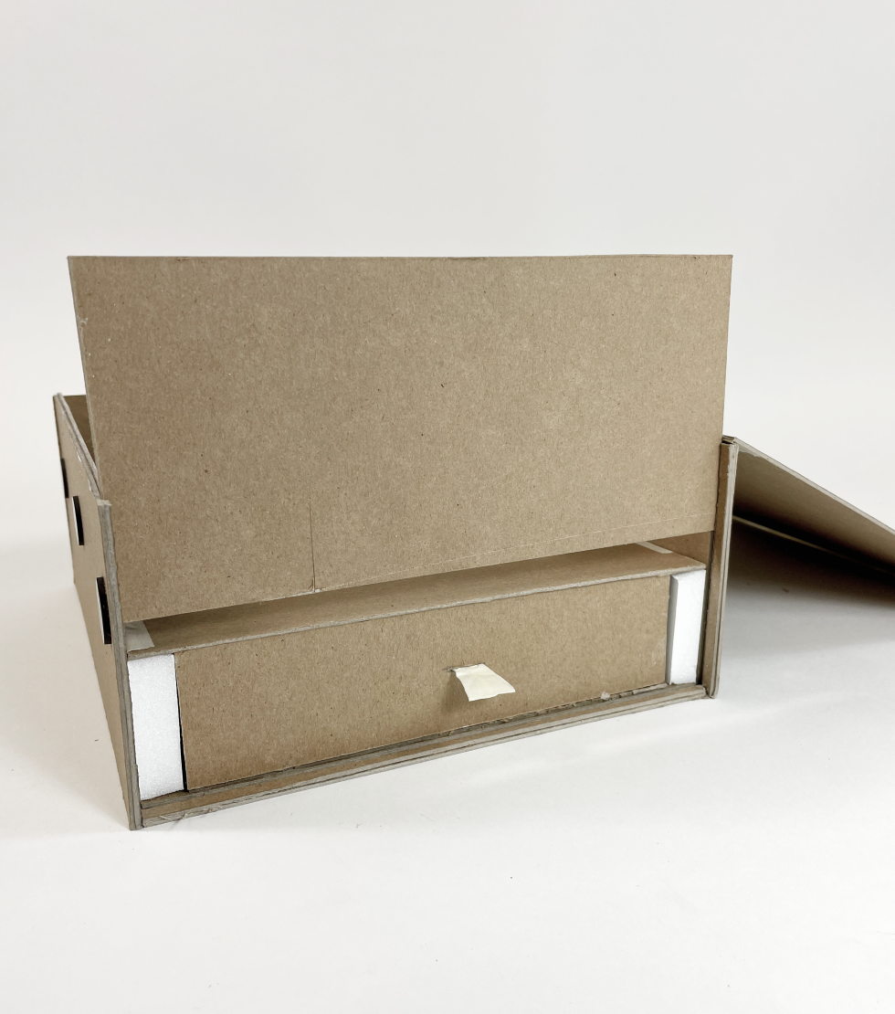 box prototype with hidden compartment revealed